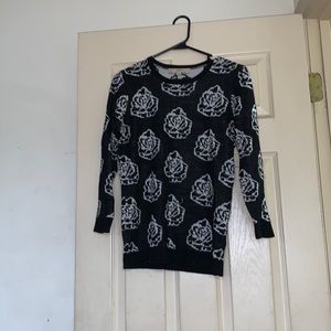 Small black sweater with white roses